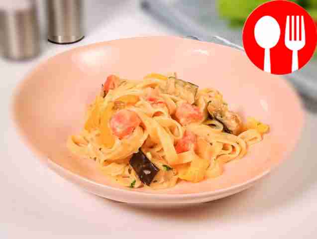 Pasta with vegetables in creamy sauce