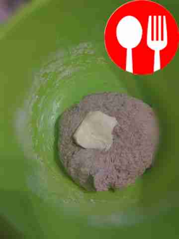 Then gradually stir soft butter into the dough.