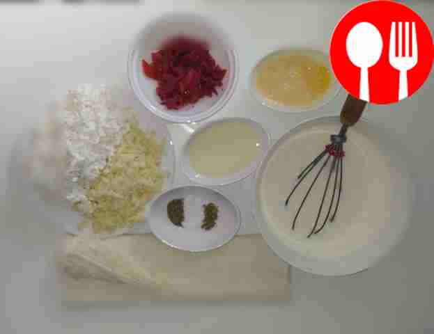 Grate the varieties of cheeses on a coarse...