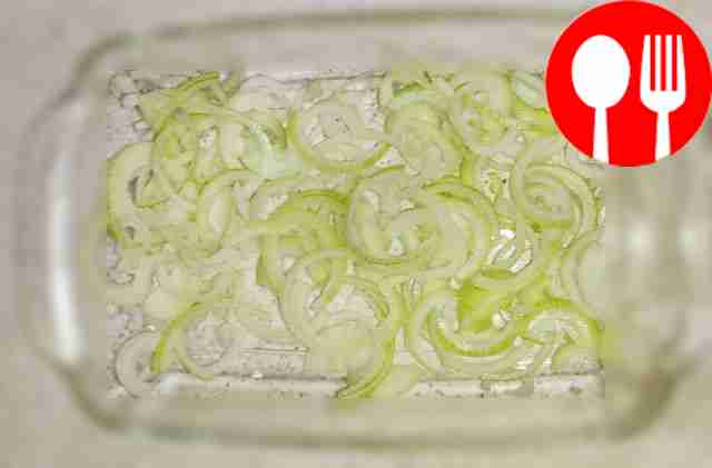 Cut the onion into half rings and place on a...