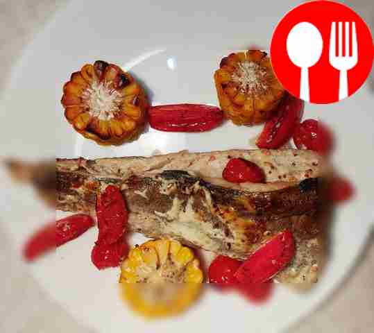 Serve the fish, garnished with fresh herbs in portions.