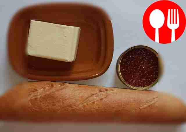 Cut off the butter. Open the jar of caviar.