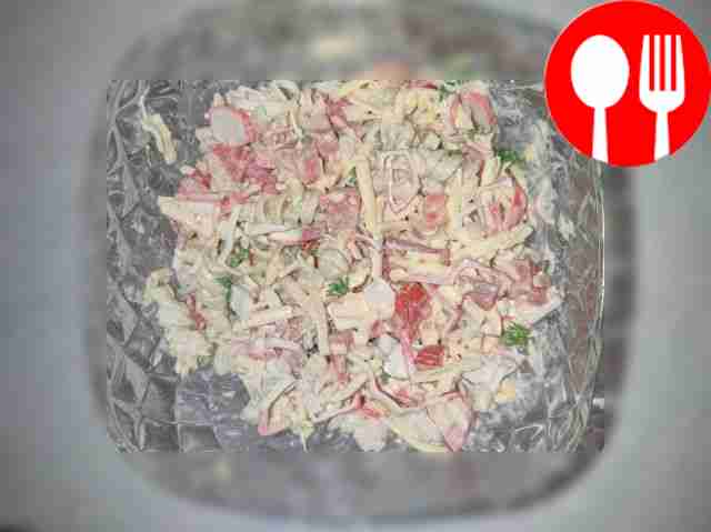 Salad with pasta, crab sticks and tomato