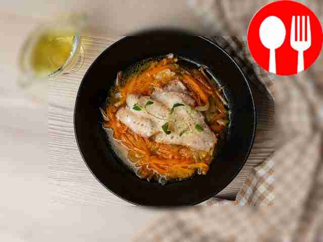 Stewed sea bass with onions and carrots