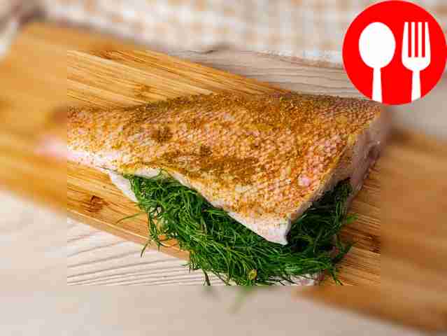 Rub the curry seasoning over the prepared sea...