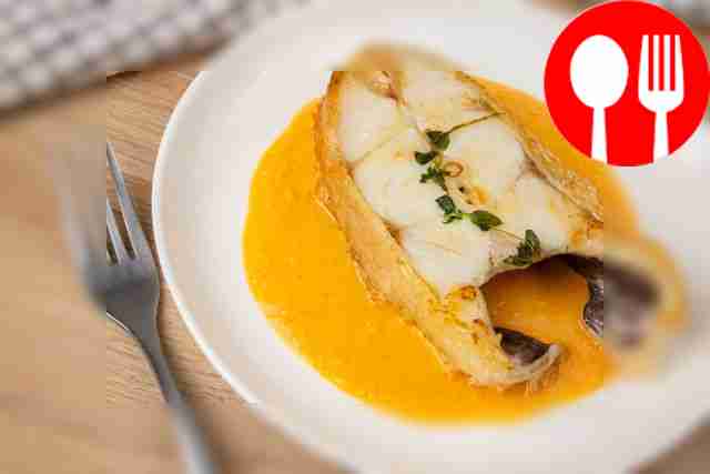 Perch with sweet and sour sauce in a frying pan