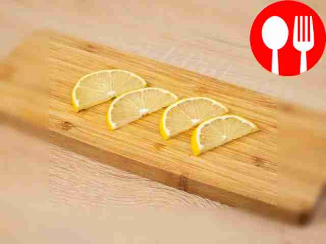Cut the lemon into thin half rings. Also cut...