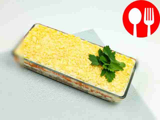 Place the final layer of chopped egg yolks....