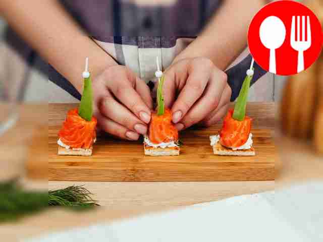 Wrap the canapé in a slice of red fish.