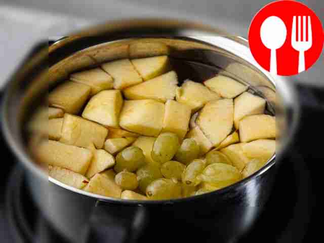 Place the apples and grapes in a suitable...