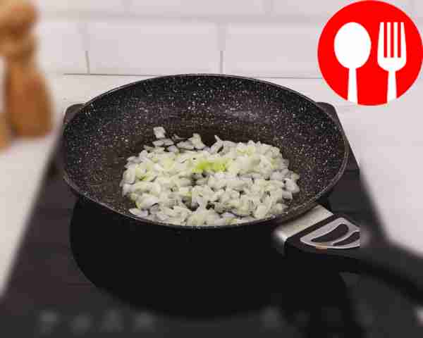 Fry the onion in a frying pan until golden brown.