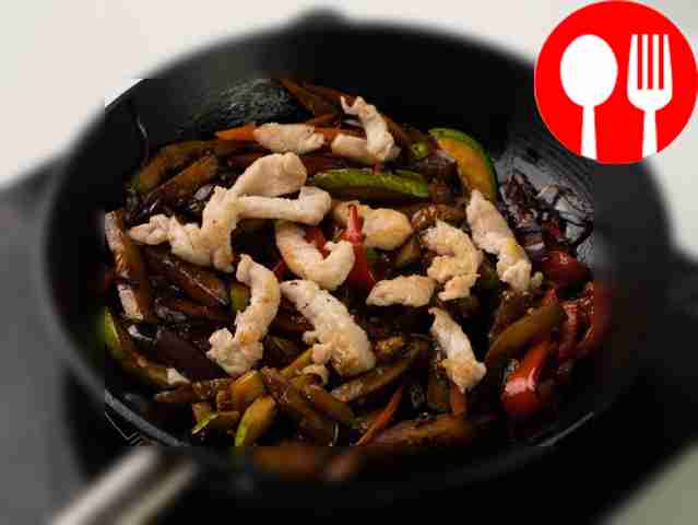 Add chicken to vegetables, add soy sauce and...