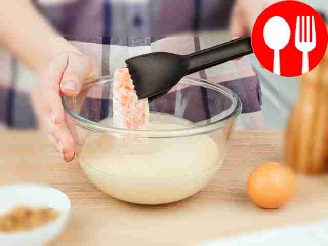 Dredge the salmon pieces in flour and then dip...