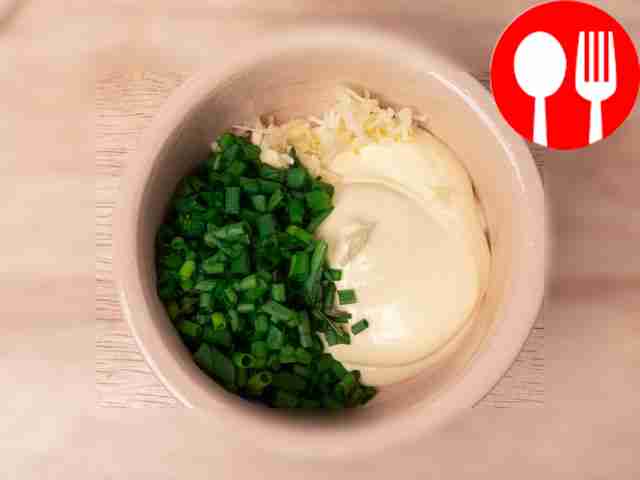 Peel two cloves of garlic and pass through a...