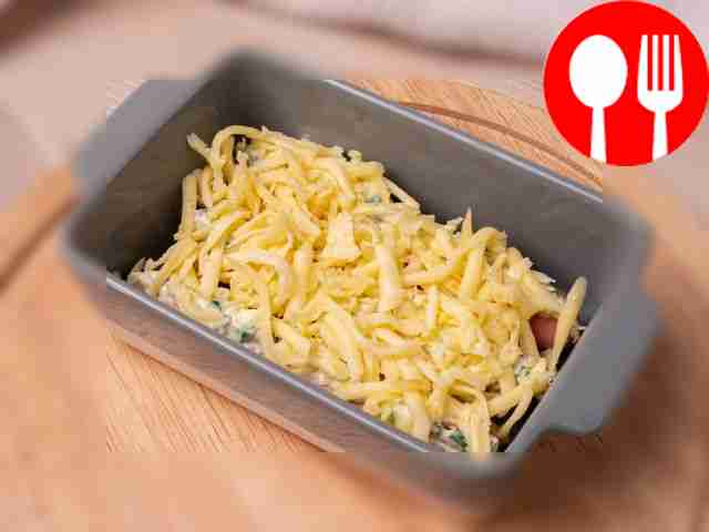 Take a baking dish and grease it with...