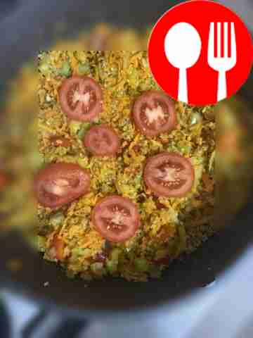 Place tomato rings and crushed garlic on top.