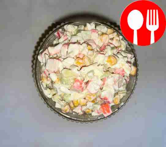 Crab salad with cucumber and hard cheese