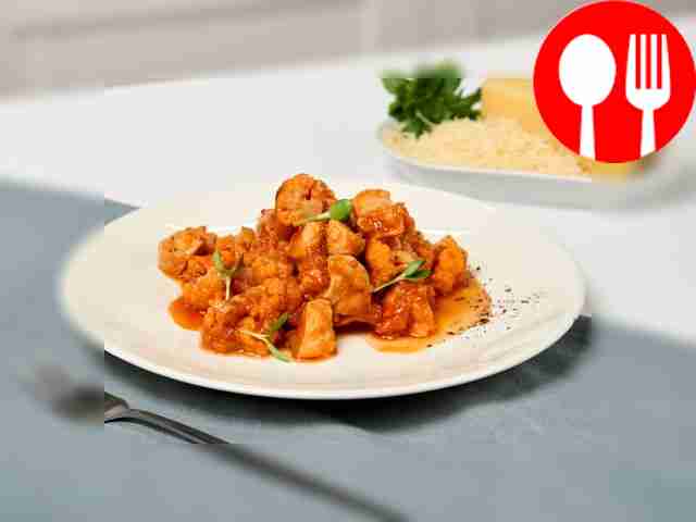 Place the chicken fillet with vegetables on...