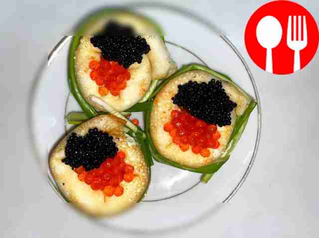 Pancake snails with caviar and curd cheese
