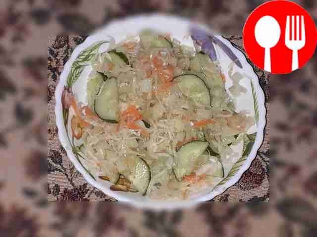 Vitamin salad of sauerkraut, fresh cucumber and celery