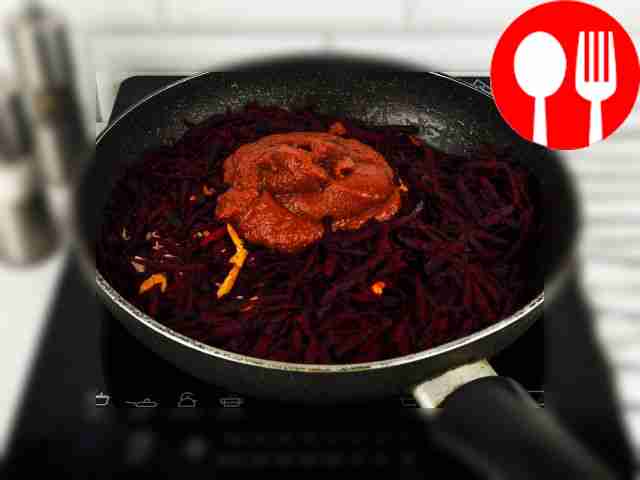 Add grated beets, garlic and tomato paste to...