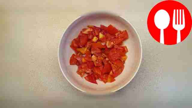 Take the tomatoes and place them on the board,...