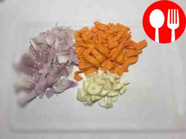 Cut carrots, onions and garlic into small...