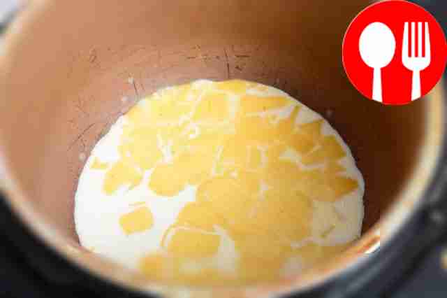 Cut the cheese into cubes and melt in a slow...