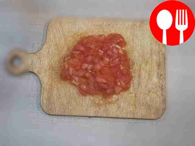 Take the tomatoes, cut them crosswise on top...