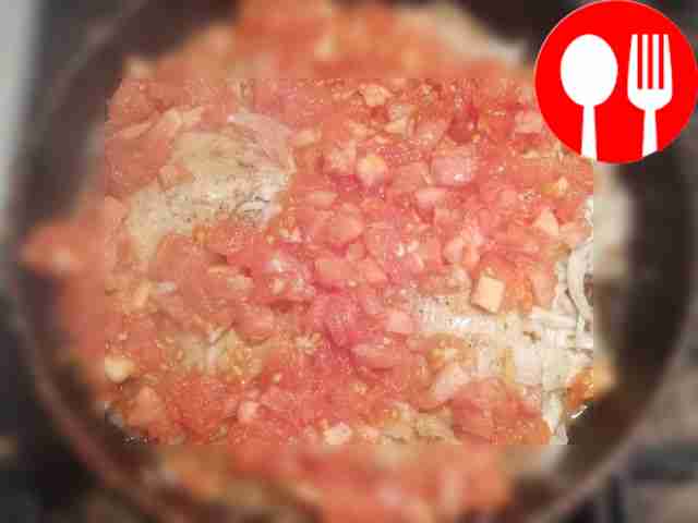 Place finely chopped tomatoes in the fried...