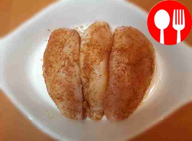 Rub the prepared chicken breasts generously...