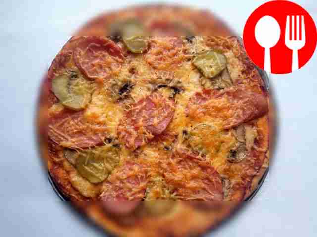 Delicious pizza with champignons and salami