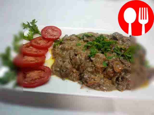 Place the dish on a plate and garnish with vegetables.