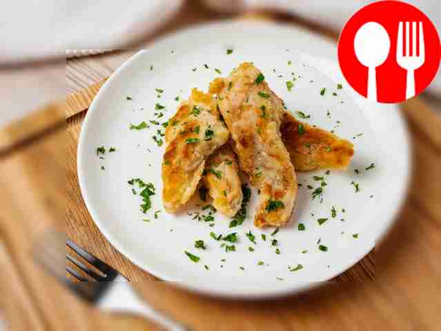 Place the fish on a plate and garnish with a...