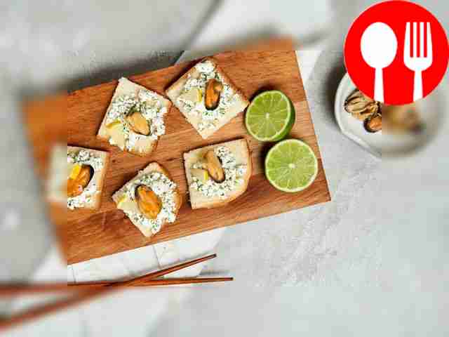 Place toast with mussels on a rectangular...