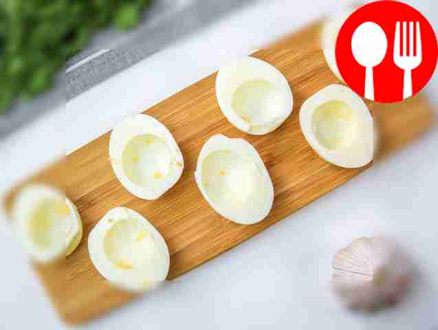 Cut the eggs in half and separate the yolks...