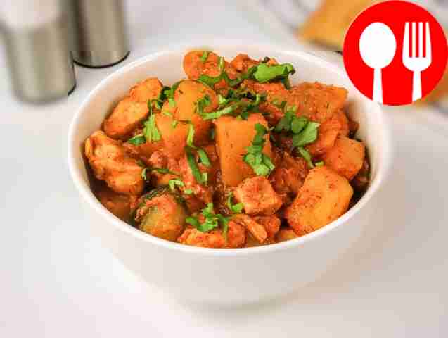 Stewed potatoes with chicken fillet and zucchini