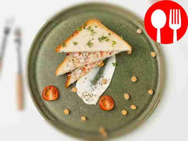 Cover a wide flat plate with lettuce leaves,...