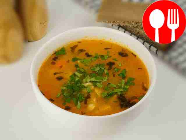 Chicken soup with rice and tomato paste