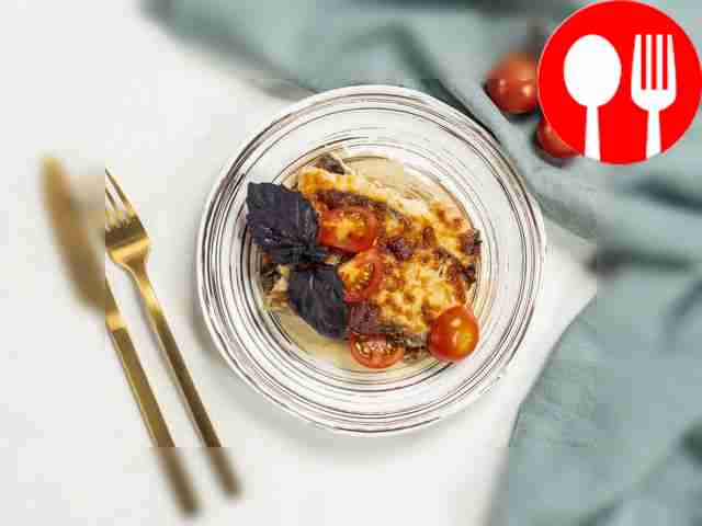 Cool the eggplant moussaka a little, cut into...