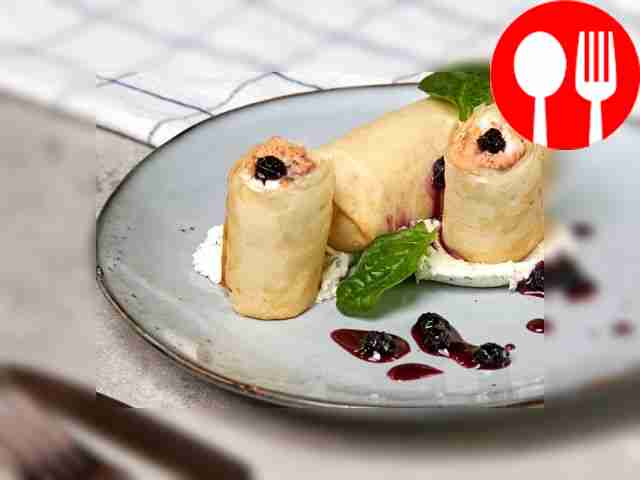 Before serving, decorate filo rolls with curd...