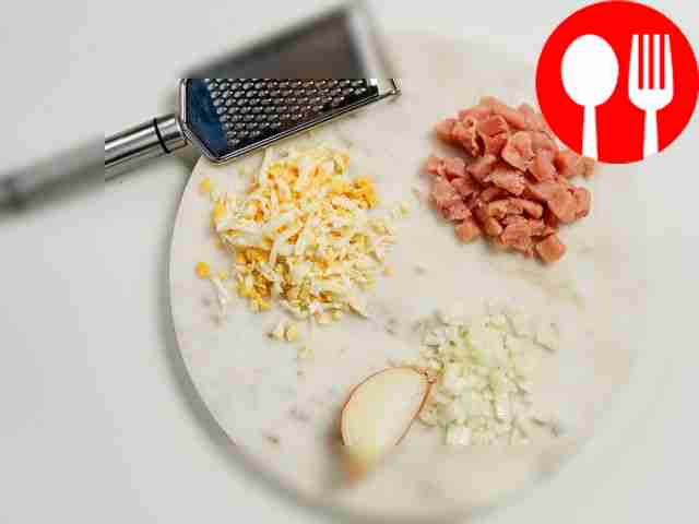 Grind the food. Grate the eggs on a coarse...