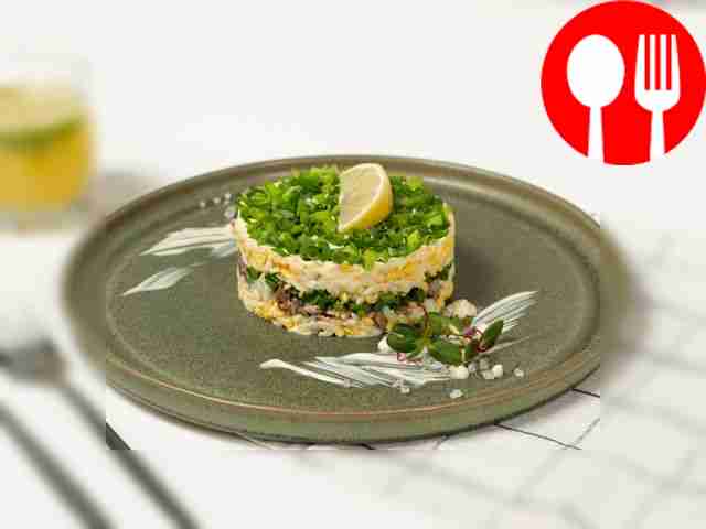 Salad with canned fish, eggs and onions