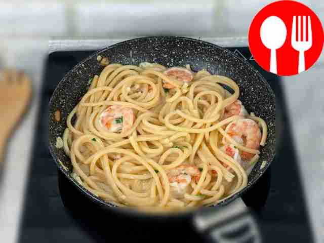 Stir the pasta. If necessary, add a little...