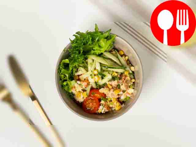 Serve the appetizing fish salad in portions,...