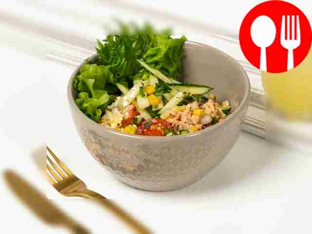 Salad with canned fish, cucumber, tomatoes and cheese