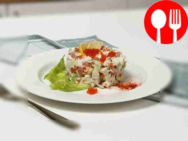 Delicious fish salad with salmon and caviar