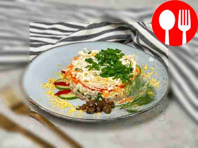 Canned fish salad with carrots and onions