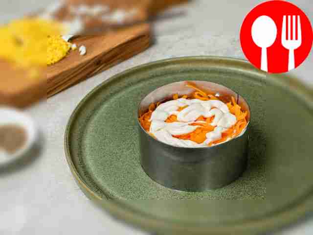 Prepare the dressing. Mix chopped garlic with...