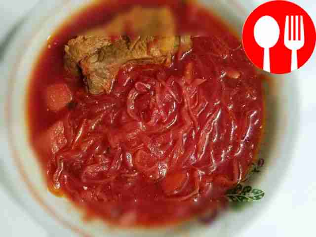 Homemade borscht made from fresh and salted cabbage with pork ribs